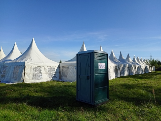 Well-maintained UrbanLoos portable toilet at a construction site in Nakuru